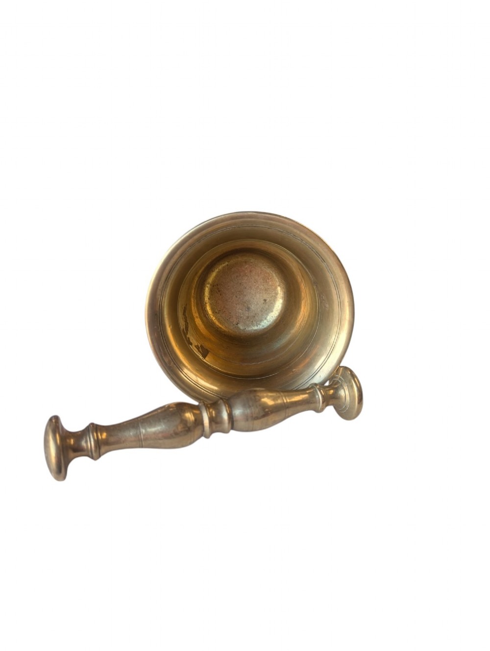 A cast brass mortar with a flared upper rim and incised lines, shown alongside a turned brass pestle. View II