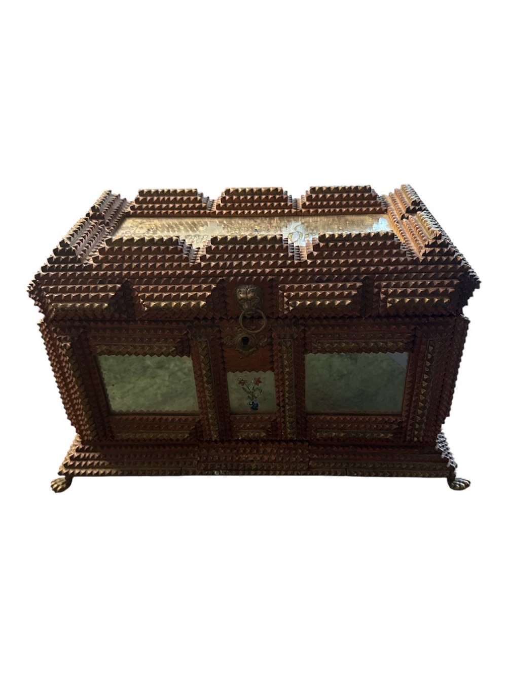 A Victorian tramp art wooden box featuring chip-carved pyramid layers, glass inserts, a metal lion head pull, and small metal feet. View II