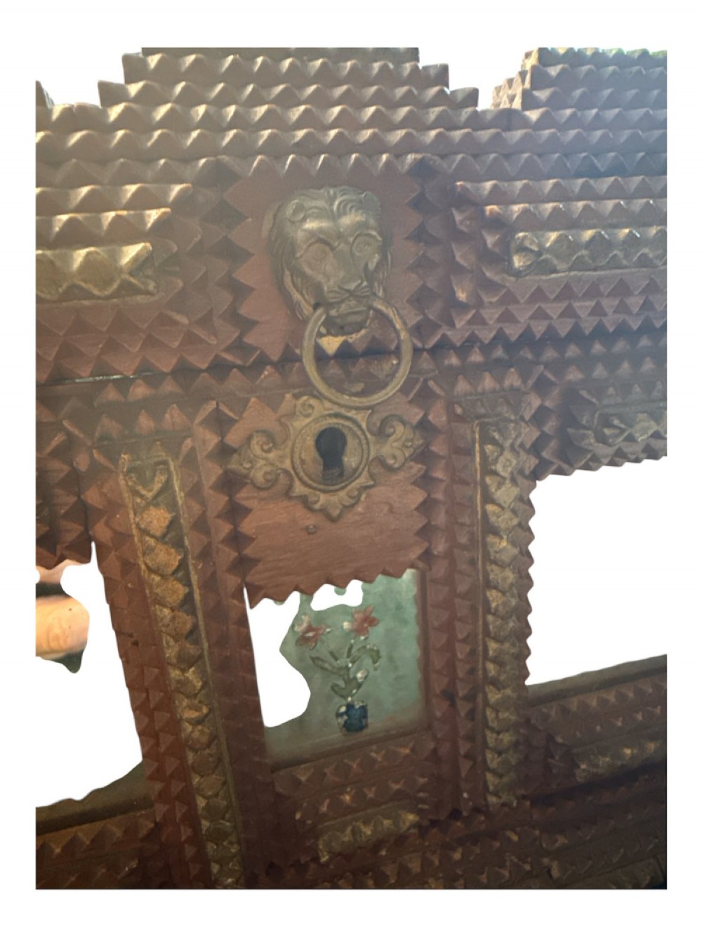 A Victorian tramp art wooden box featuring chip-carved pyramid layers, glass inserts, a metal lion head pull, and small metal feet. View IV