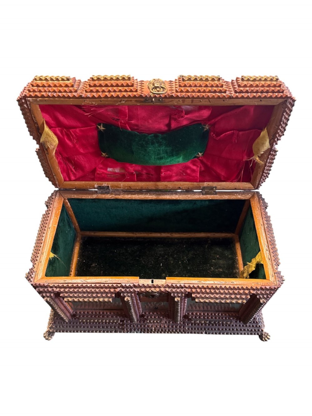 A Victorian tramp art wooden box featuring chip-carved pyramid layers, glass inserts, a metal lion head pull, and small metal feet. View VII
