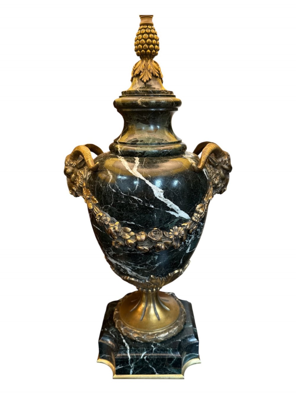 A pair of 19th-century French table lamps crafted from dark veined marble in urn shapes with gilt metal mounts and amber fabric shades featuring fringe trim. View III