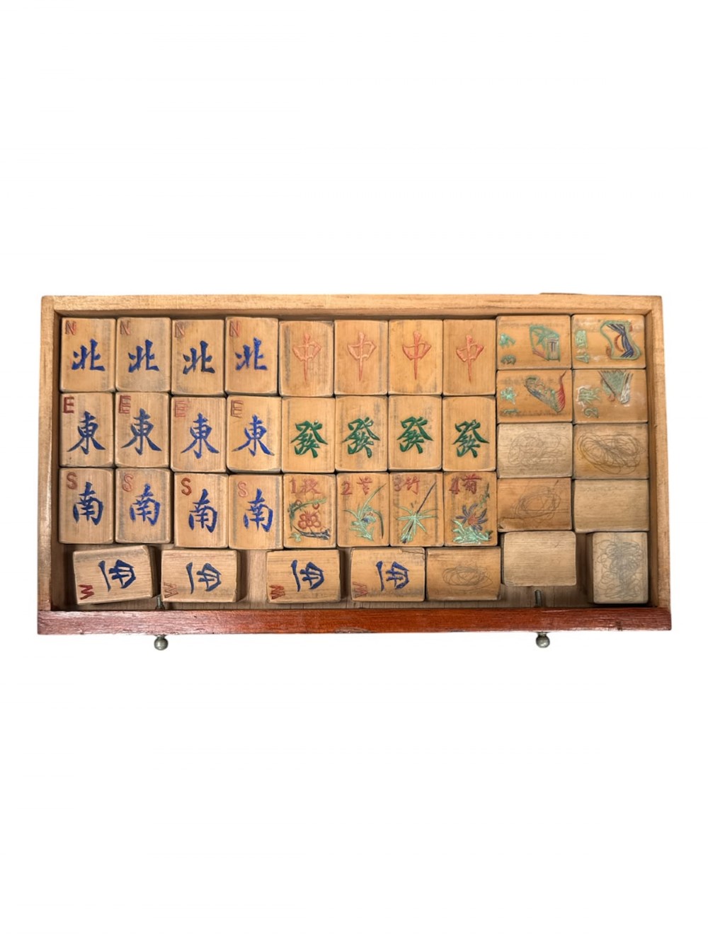 An antique warm brown wooden cabinet featuring a metal top handle, a removable front panel with red characters, and multiple drawers holding mahjong tiles and counting sticks. View II
