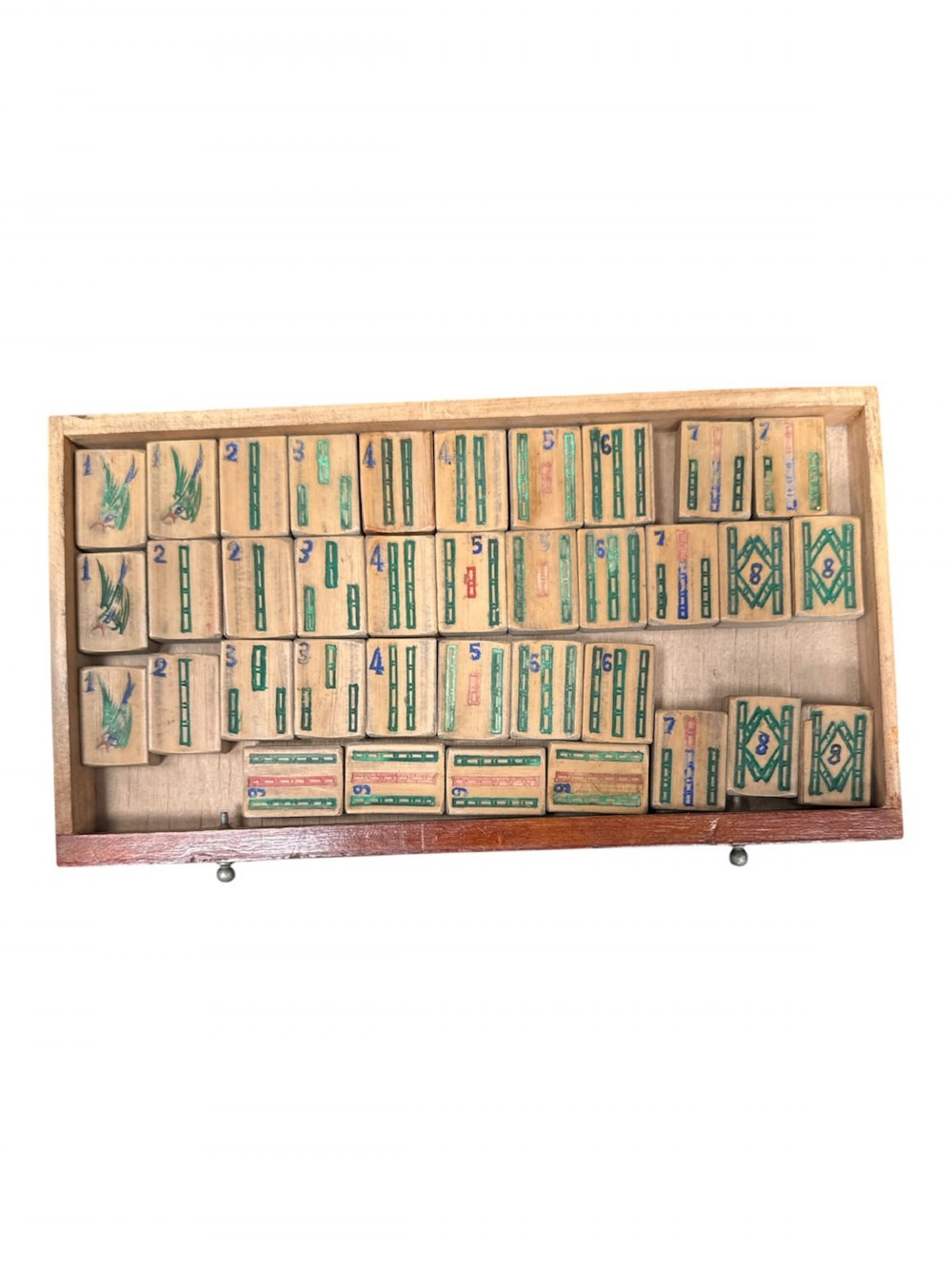 An antique warm brown wooden cabinet featuring a metal top handle, a removable front panel with red characters, and multiple drawers holding mahjong tiles and counting sticks. View IV