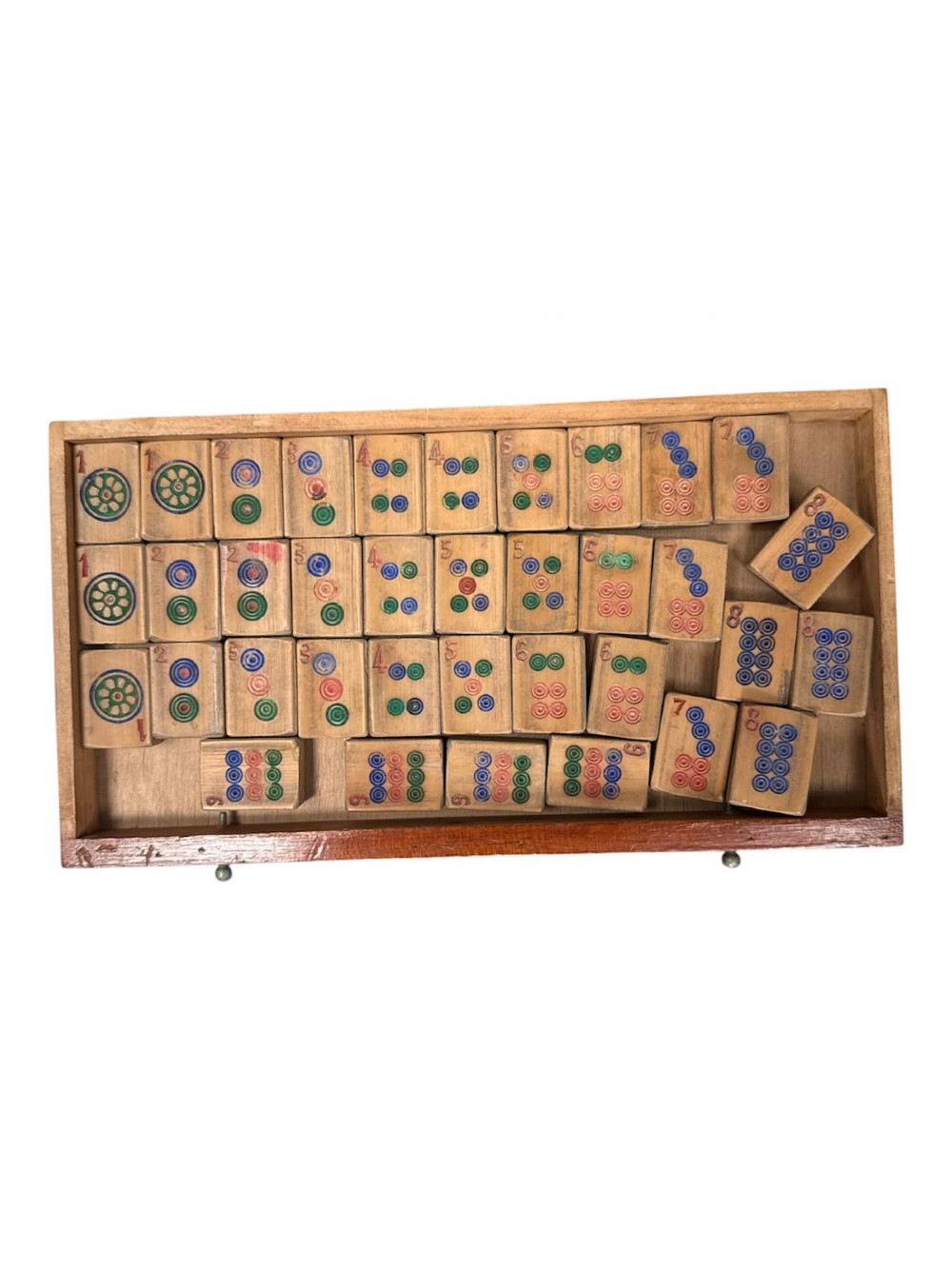 An antique warm brown wooden cabinet featuring a metal top handle, a removable front panel with red characters, and multiple drawers holding mahjong tiles and counting sticks. View V