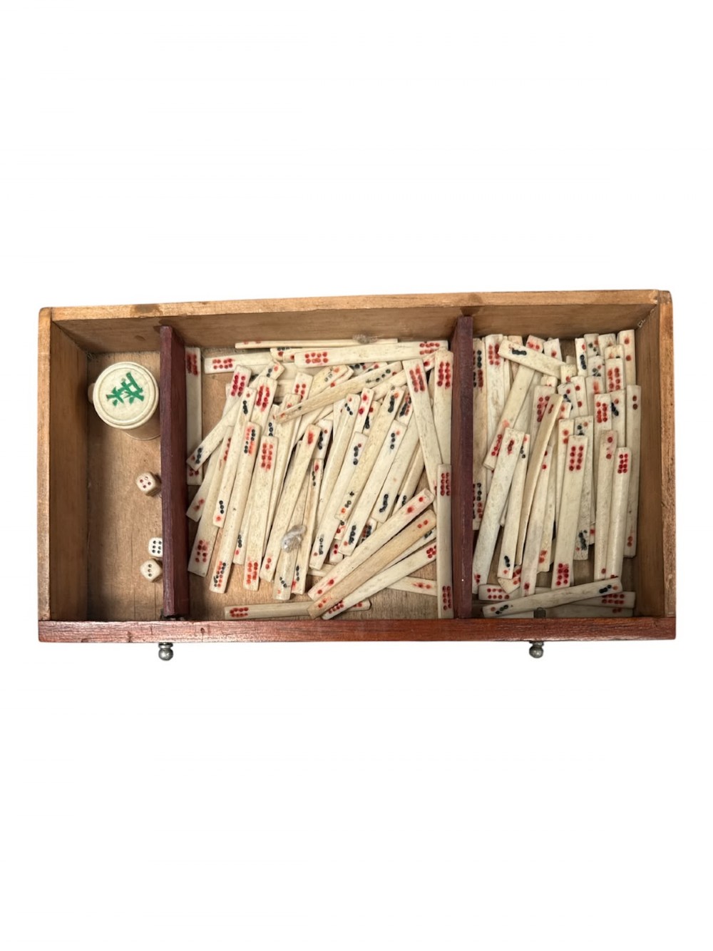 An antique warm brown wooden cabinet featuring a metal top handle, a removable front panel with red characters, and multiple drawers holding mahjong tiles and counting sticks. View VI