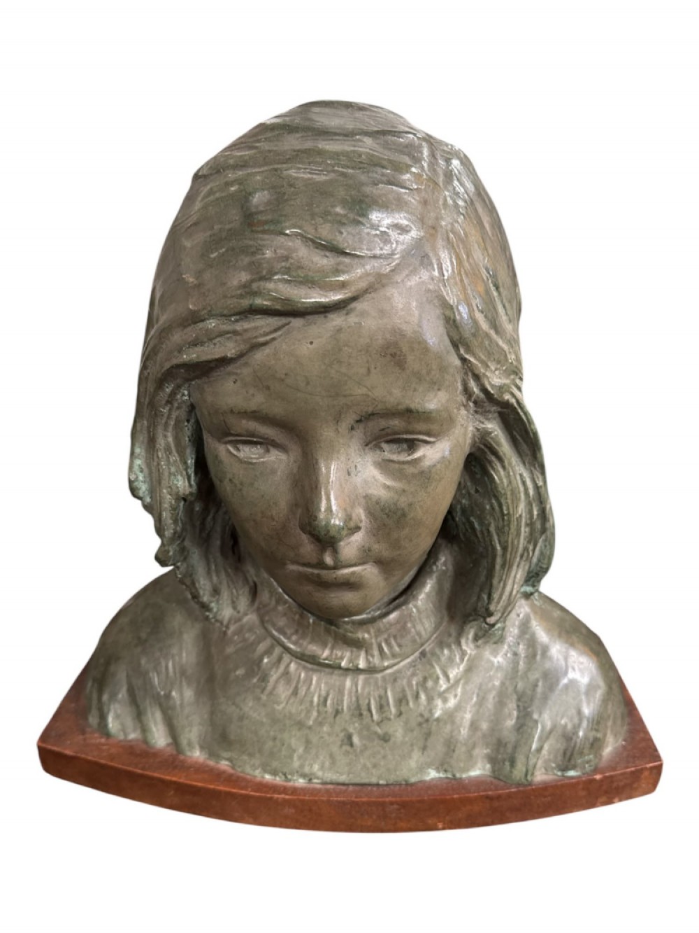 A bronzed metal portrait bust of a young girl with shoulder-length hair, mounted on a curved wooden base.