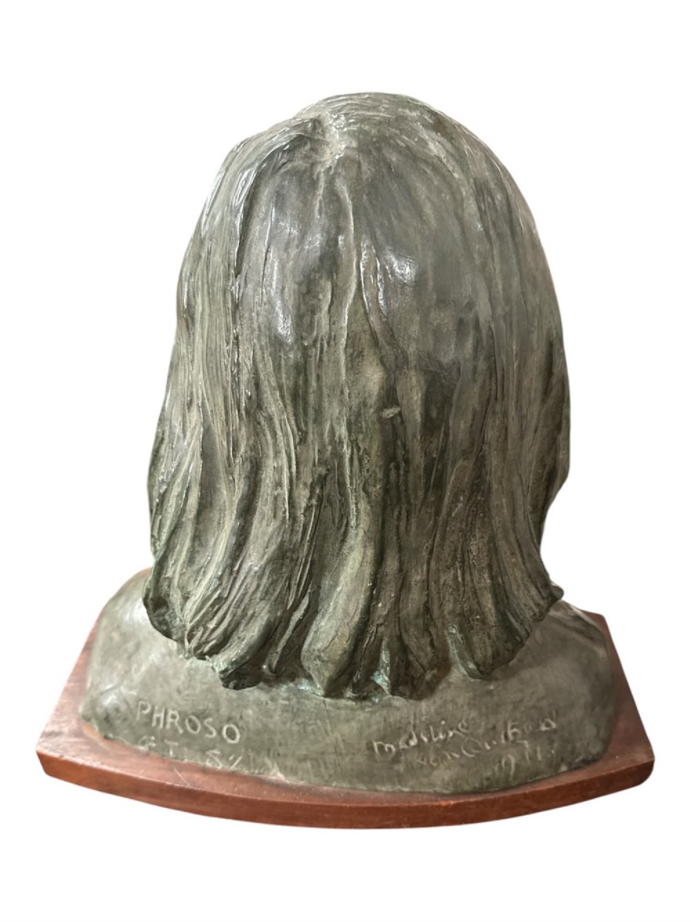 A bronzed metal portrait bust of a young girl with shoulder-length hair, mounted on a curved wooden base. View II