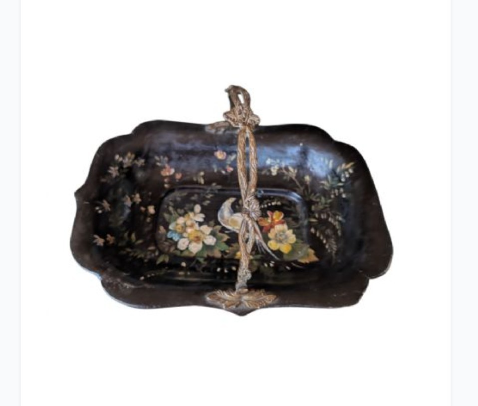 Victorian black lacquered papier-mache basket featuring hand-painted floral motifs, a bird illustration, a scalloped border, and a gilt metal swing handle.