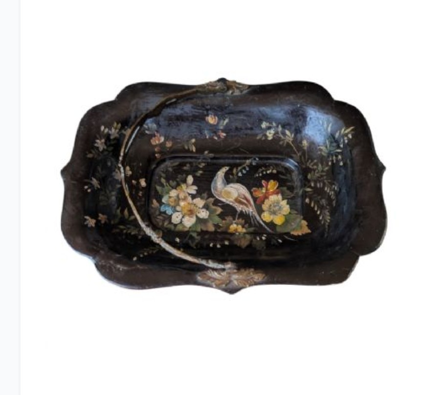 Victorian black lacquered papier-mache basket featuring hand-painted floral motifs, a bird illustration, a scalloped border, and a gilt metal swing handle. View II