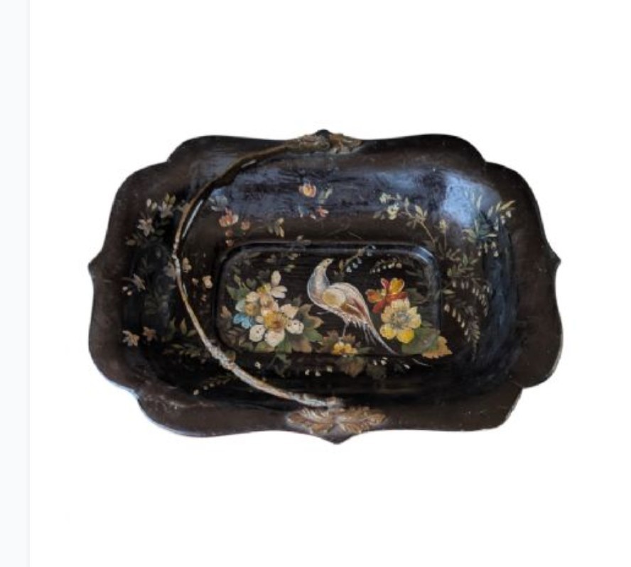 Victorian black lacquered papier-mache basket featuring hand-painted floral motifs, a bird illustration, a scalloped border, and a gilt metal swing handle. View VII