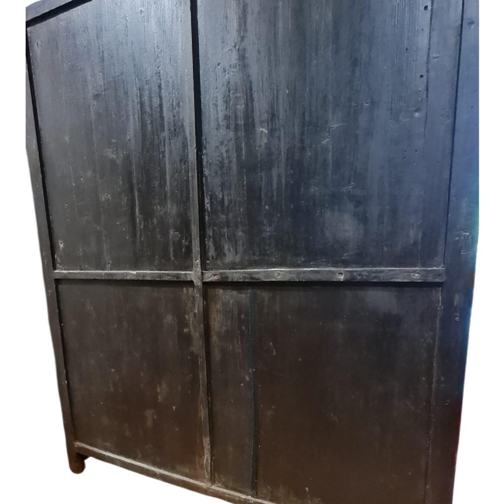 A tall dark elm Chinese apothecary chest featuring multiple small drawers inscribed with calligraphic characters above three larger base drawers. View II