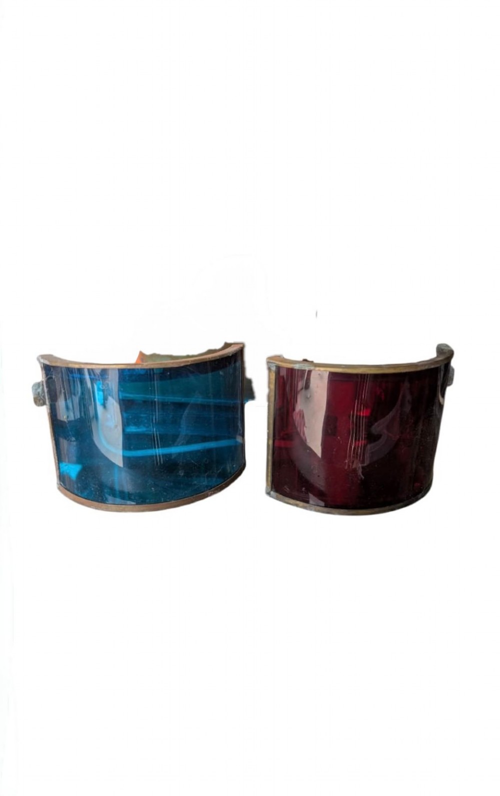 A pair of copper and brass maritime ship lanterns featuring curved Fresnel glass lenses and top carrying handles. View XI