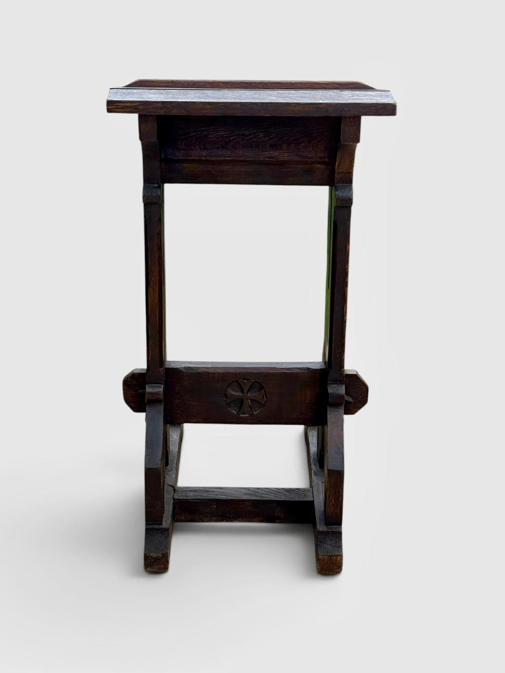 A dark oak antique prayer desk featuring a slanted bookrest shelf, carved gothic side supports, and a built-in kneeling platform. View VIII