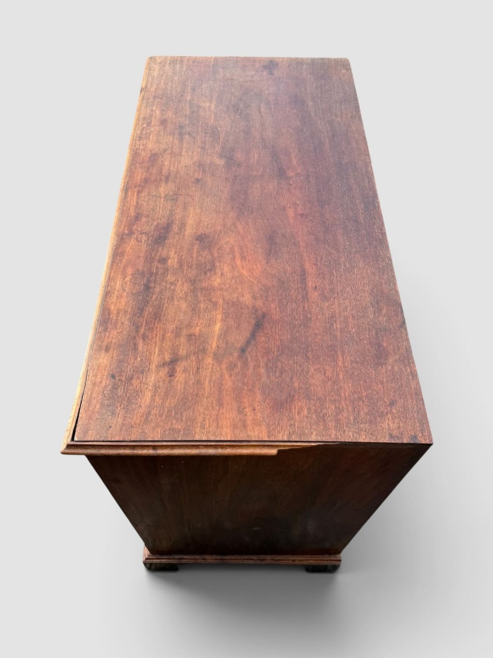 A Georgian mahogany chest of drawers featuring a two-over-three drawer configuration with brass swan-neck handles and bracket feet. View VIII