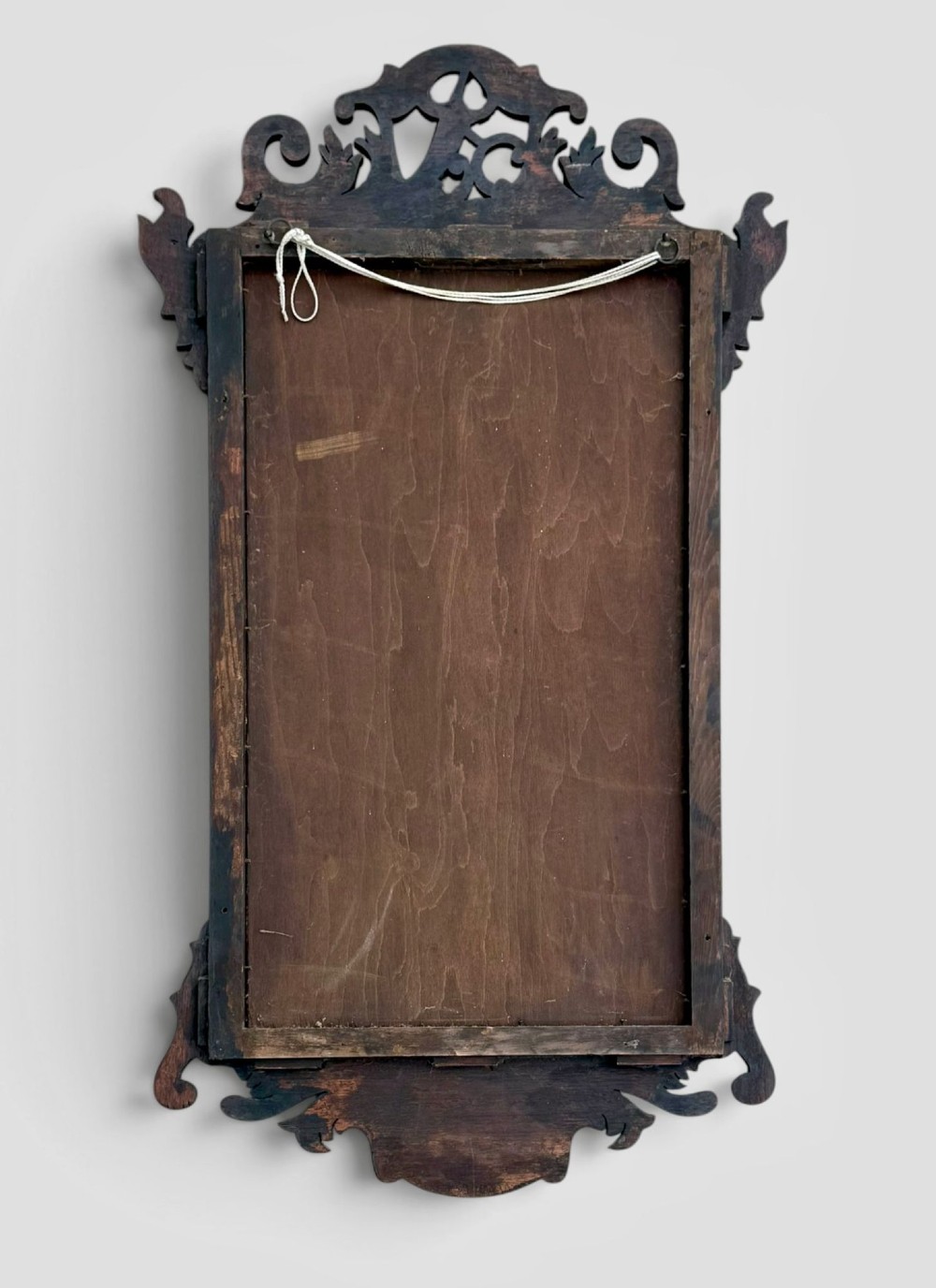 A rectangular Georgian style dark mahogany wall mirror featuring a gilded ho-ho bird crest, gilt inner slip border, and a carved shell marquetry medallion at the base. View III