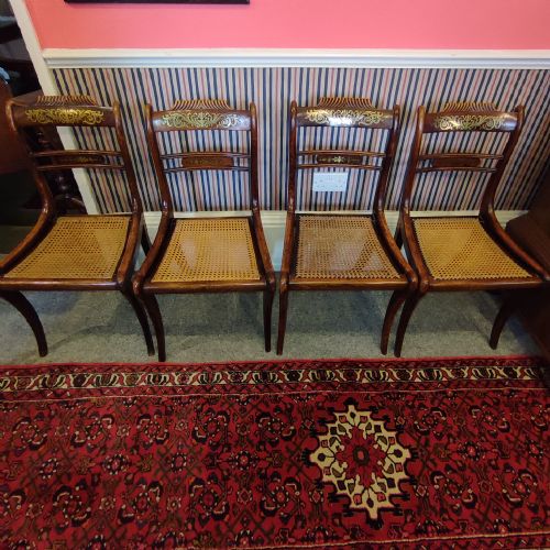 Set of Four Regency Brass Inlaid Rosewood Chairs with Cane Seats.