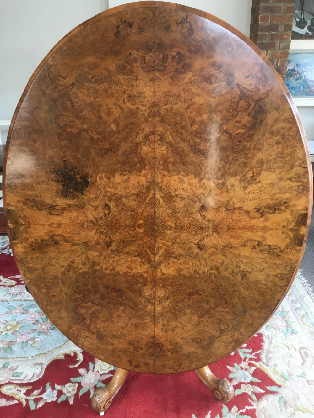 Victorian Burr Walnut Tilt-Top Dining/Centre Table on Carved Pedestal with Floral Decoration.