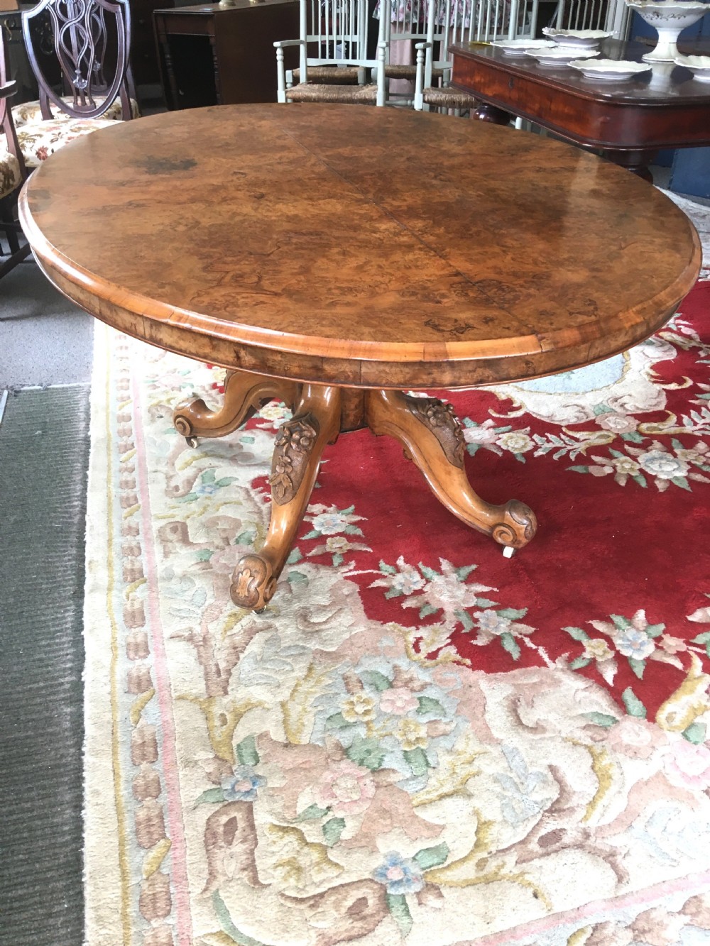 Victorian Burr Walnut Tilt-Top Dining/Centre Table on Carved Pedestal with Floral Decoration. View II