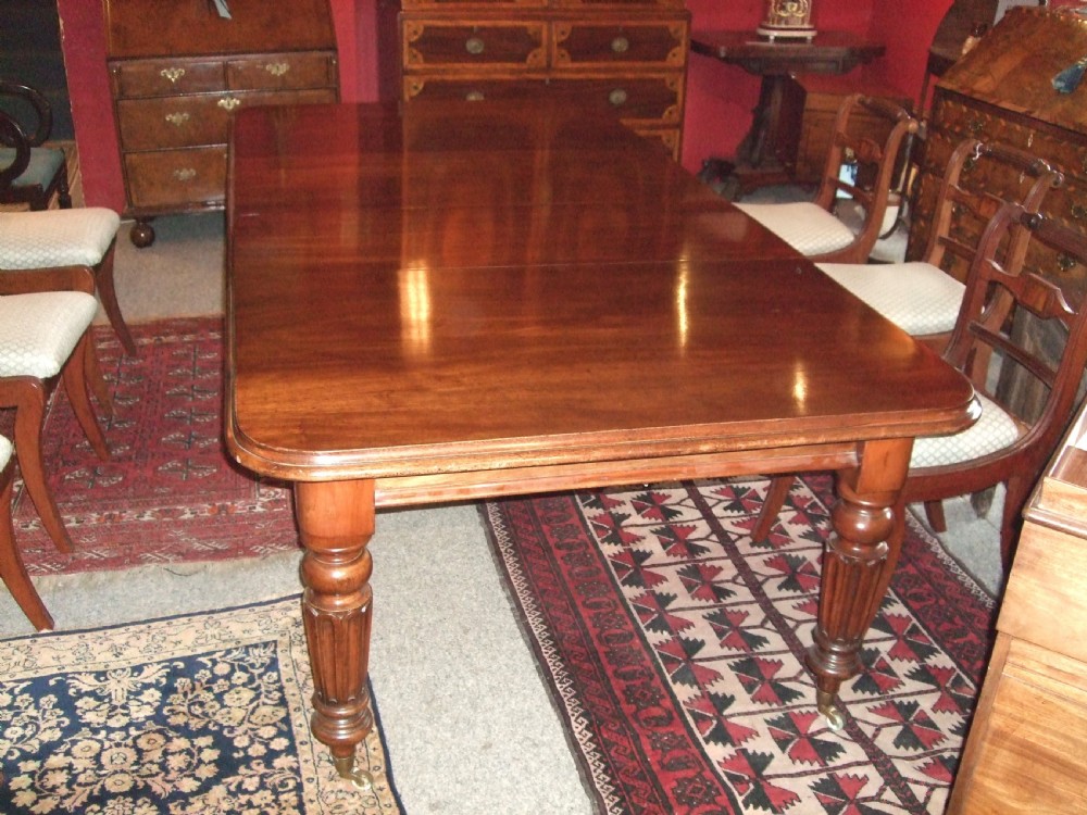 Early Victorian Wind Out Mahogany Dining Table with 2 Leaves.
