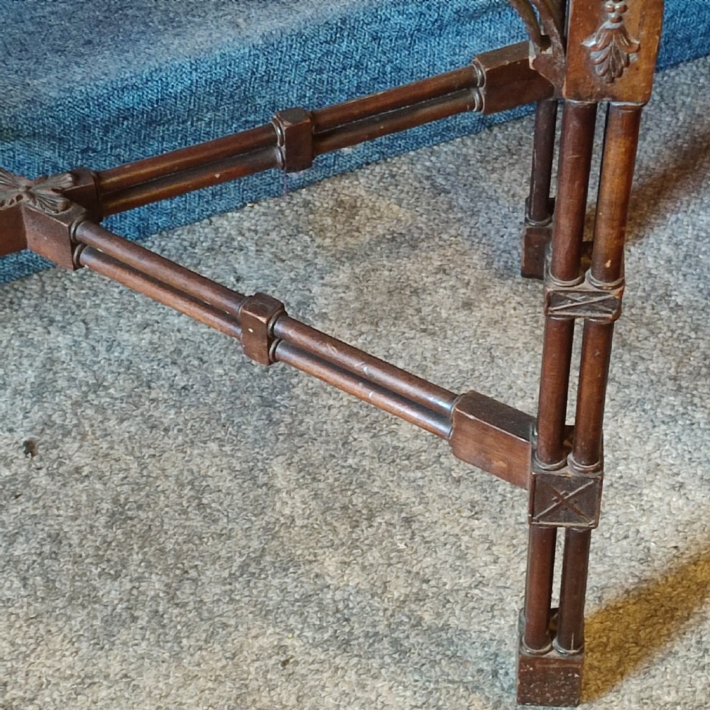 A nineteenth-century mahogany silver table crafted in the Chippendale style, featuring a shaped top, carved fretwork frieze, cluster-column legs, and an X-stretcher. View IV