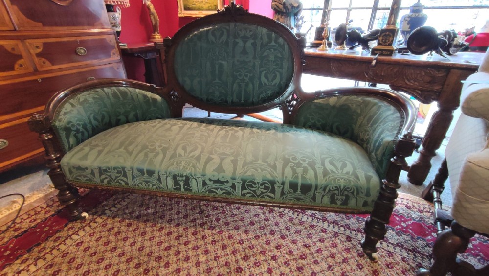 Victorian Simulated Rosewood Sofa with Carved Decoration.