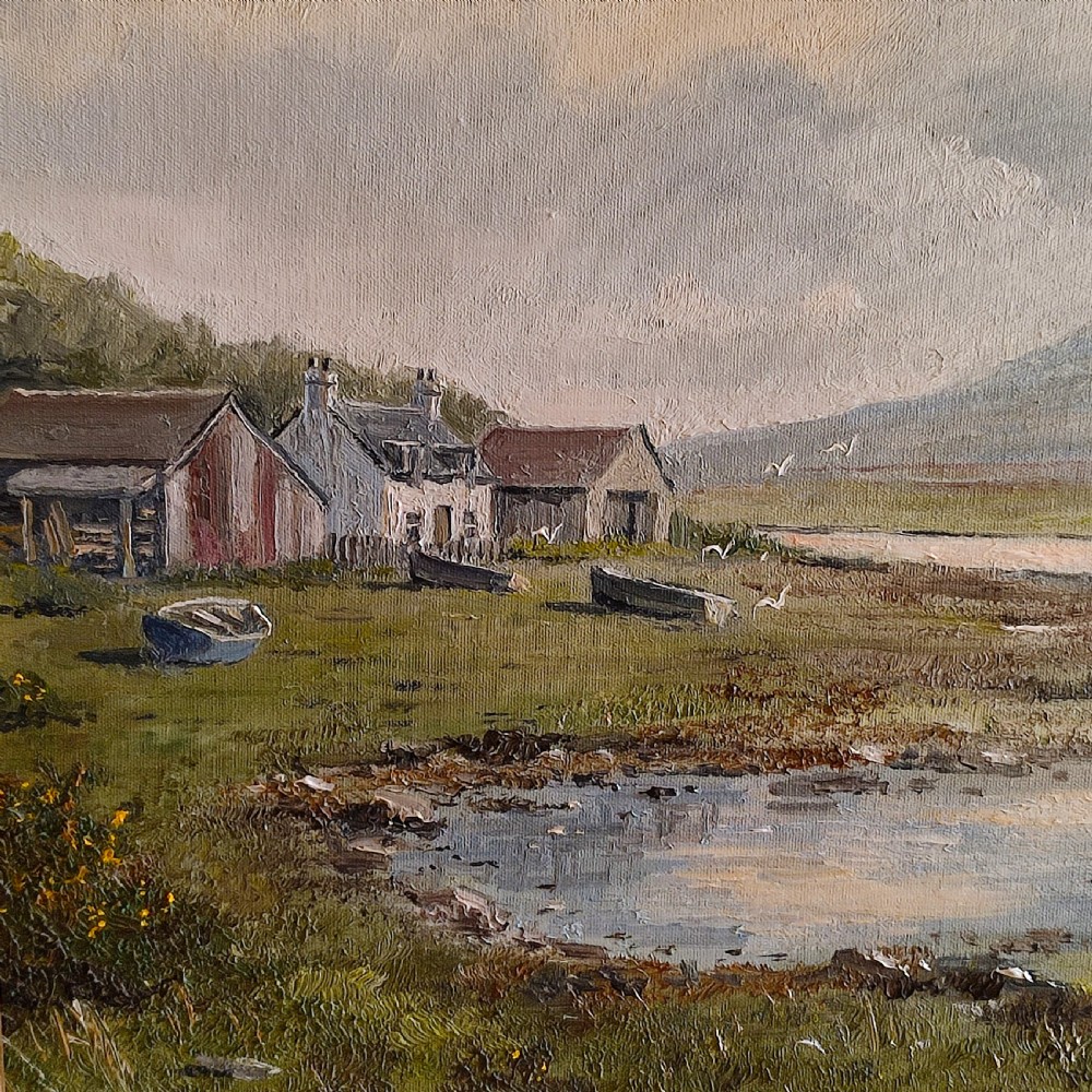 An original 20th-century oil painting depicting a coastal landscape with small cottages, boats, and distant mountains, set in a carved gold gilded frame. View II
