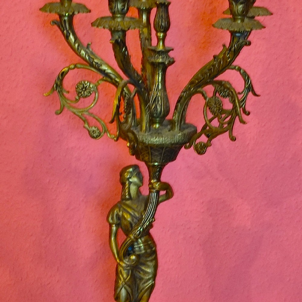 A pair of early 20th-century gilt metal five-light candelabra with classical female figure standards on marble plinths. View IV