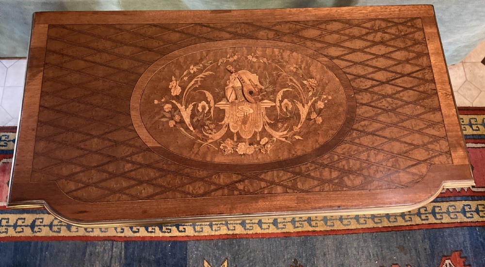 A 19th-century walnut card table featuring a floral marquetry top, brass ormolu trim, fluted tapering legs, and a hinged flip-top. View III