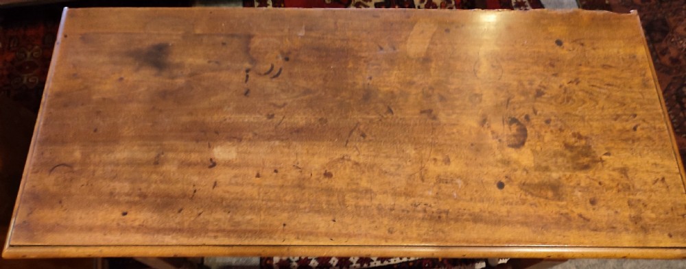 A 19th-century walnut dough bin featuring a rectangular hinged lid, clean panelled sides, an iron keyhole escutcheon, turned lower legs, and horizontal stretchers. View II