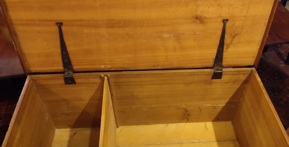 A 19th-century walnut dough bin featuring a rectangular hinged lid, clean panelled sides, an iron keyhole escutcheon, turned lower legs, and horizontal stretchers. View III