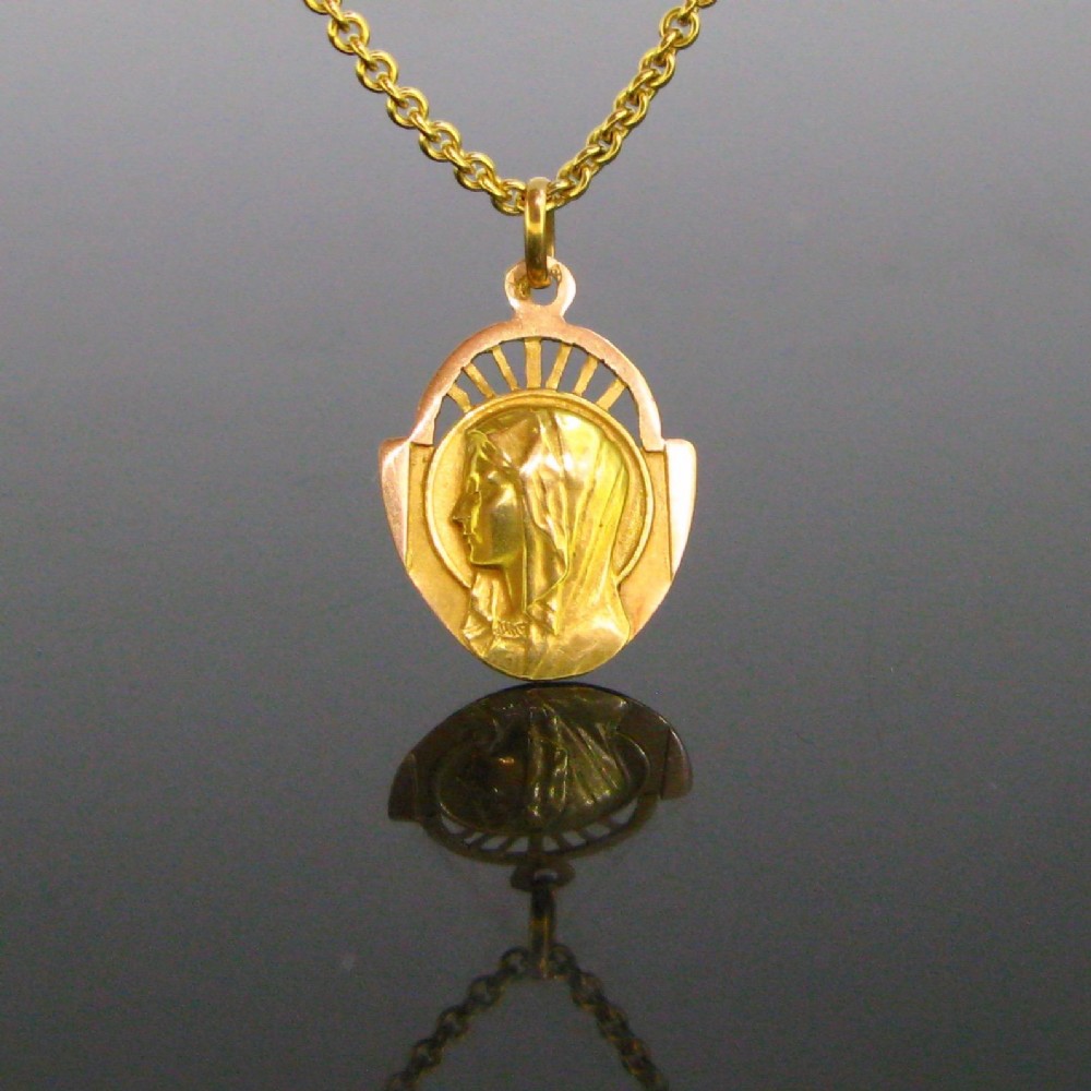 Art Deco Saint Religious Cut out Medal Pendant,18kt yellow and rose gold,  circa 1930, France