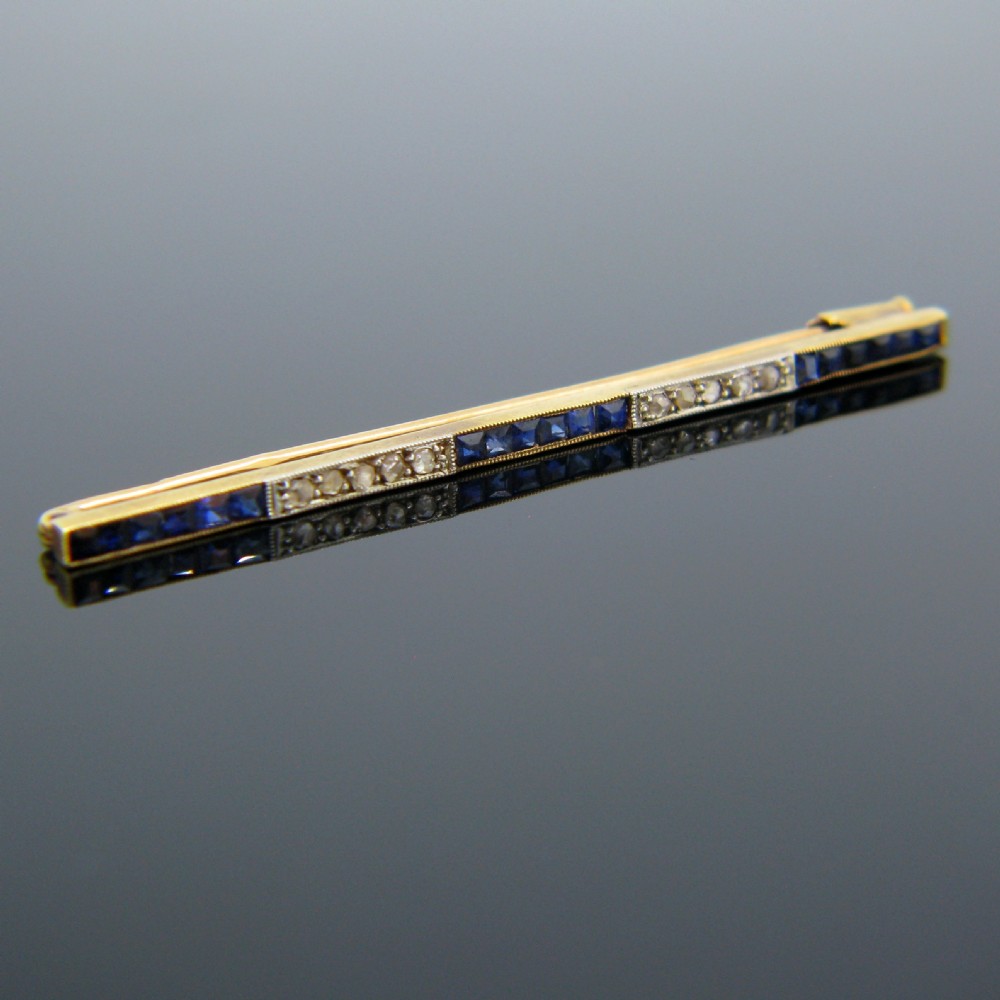 Synthetic Sapphire and Diamonds Bar Brooch, 18kt Gold and Platinum, circa 1920