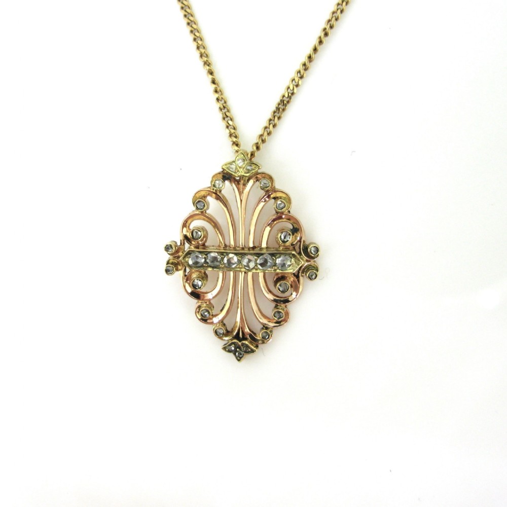 An ornate Art Nouveau gold pendant featuring rose cut diamonds set in 18kt yellow and rose gold, suspended from a matching gold chain. View III