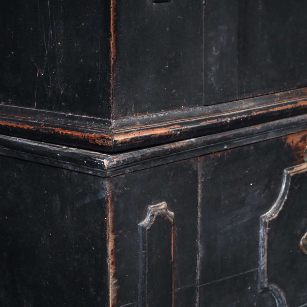 An 18th-century Tuscan cabinet featuring a distressed black painted finish, moulded cornice, panelled double doors, and lower drawers on bracket feet. View IV
