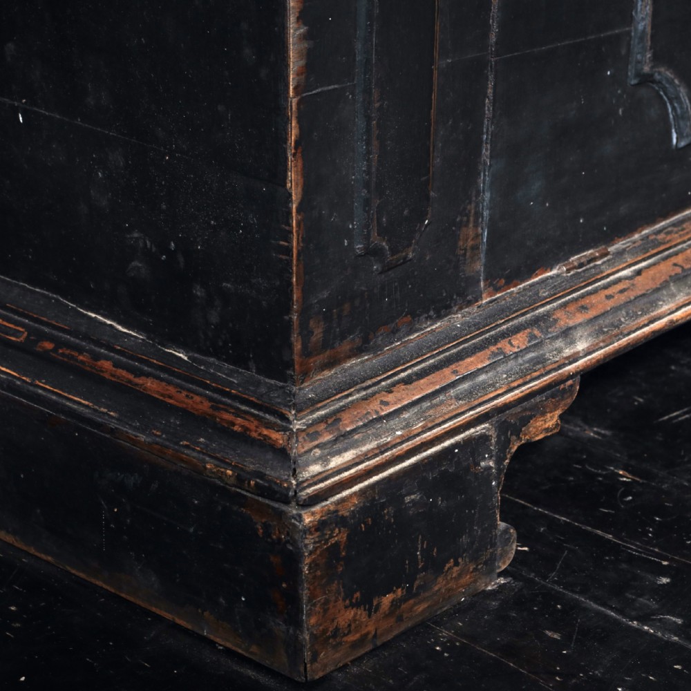 An 18th-century Tuscan cabinet featuring a distressed black painted finish, moulded cornice, panelled double doors, and lower drawers on bracket feet. View VIII