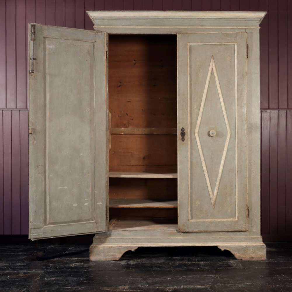 A nineteenth-century Italian painted timber cupboard featuring double doors with raised diamond panel mouldings and a muted grey finish. View II