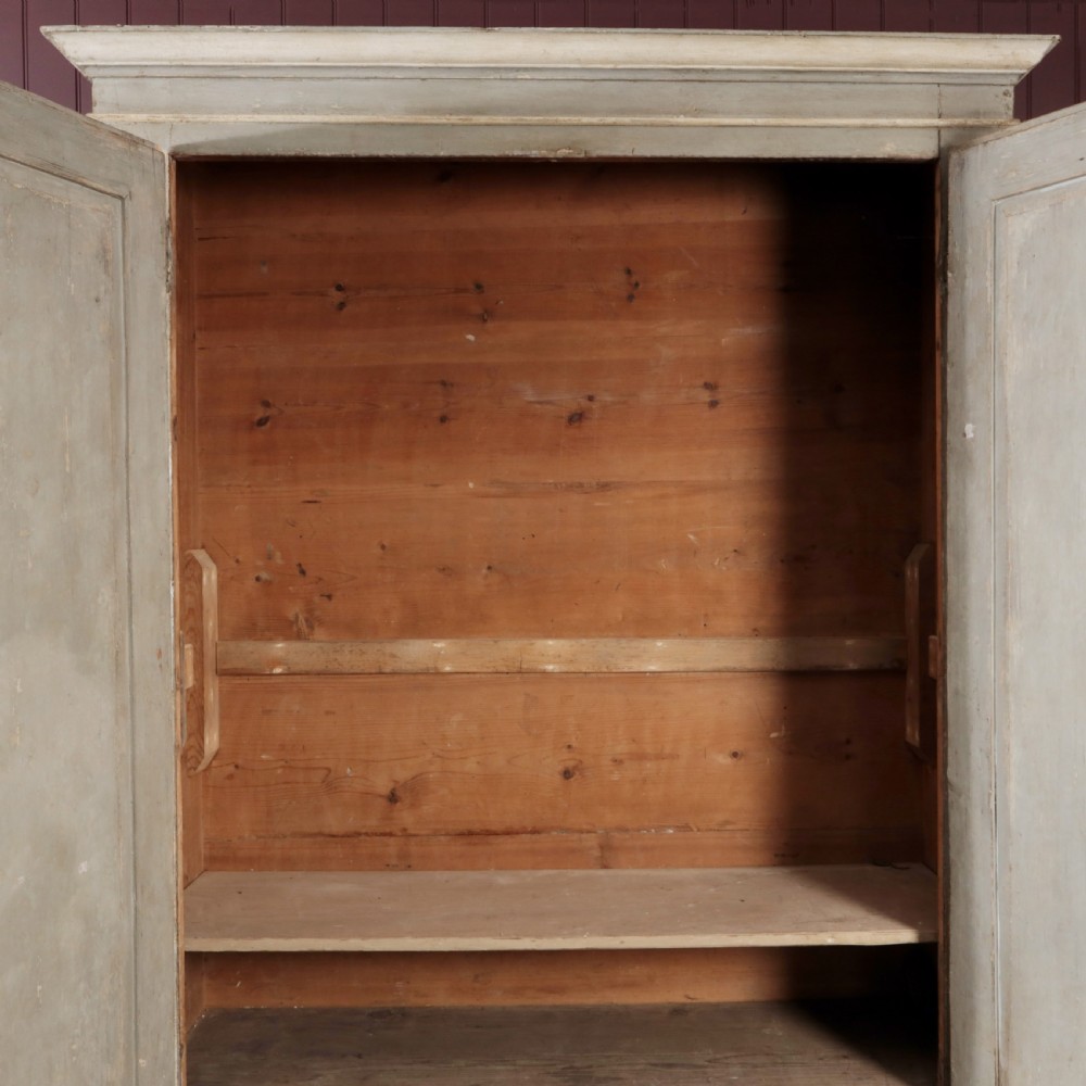 A nineteenth-century Italian painted timber cupboard featuring double doors with raised diamond panel mouldings and a muted grey finish. View V