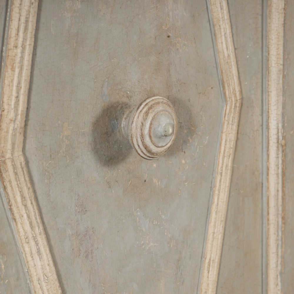 A nineteenth-century Italian painted timber cupboard featuring double doors with raised diamond panel mouldings and a muted grey finish. View VI