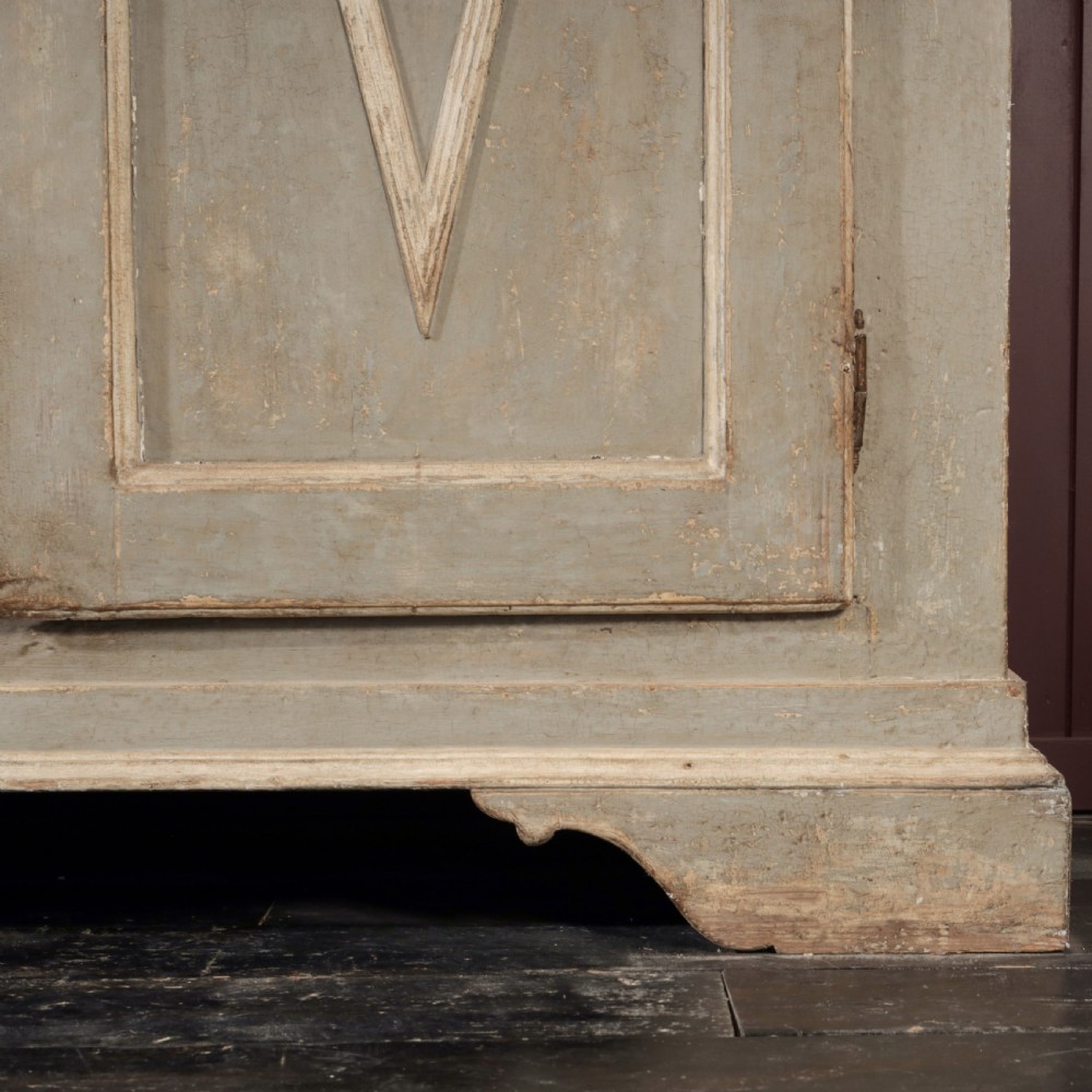 A nineteenth-century Italian painted timber cupboard featuring double doors with raised diamond panel mouldings and a muted grey finish. View VII