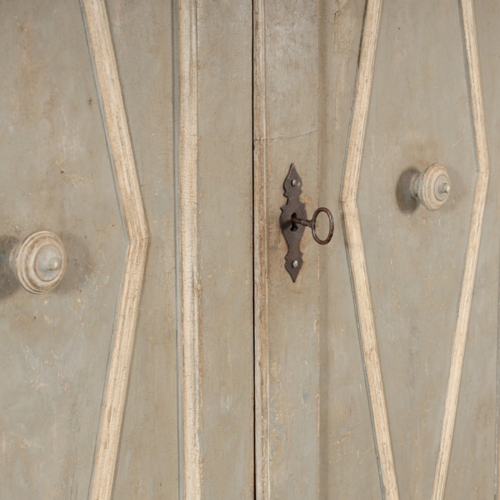 A nineteenth-century Italian painted timber cupboard featuring double doors with raised diamond panel mouldings and a muted grey finish. View XI