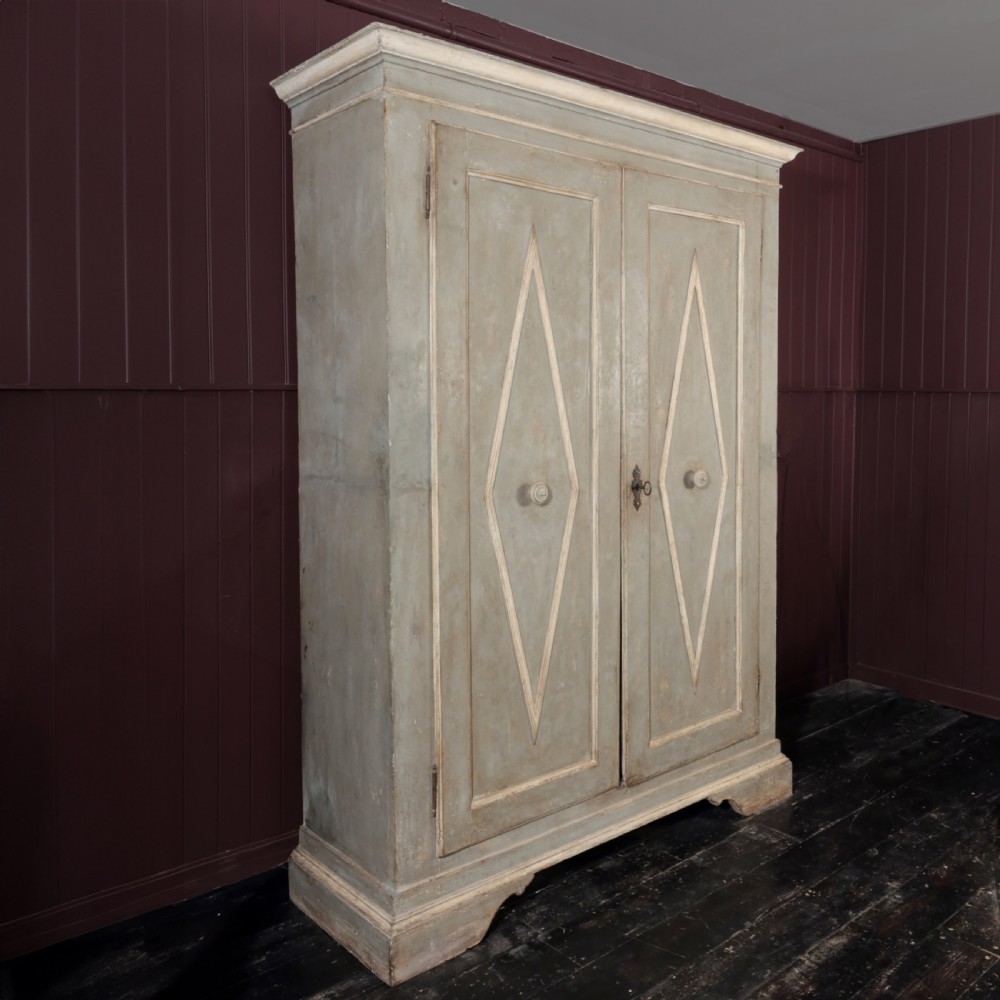 A nineteenth-century Italian painted timber cupboard featuring double doors with raised diamond panel mouldings and a muted grey finish. View XIII