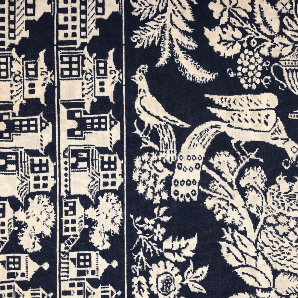 A nineteenth-century woven Jacquard coverlet in navy blue and cream featuring repeating floral urns, birds, and an architectural border with fringe. View VIII