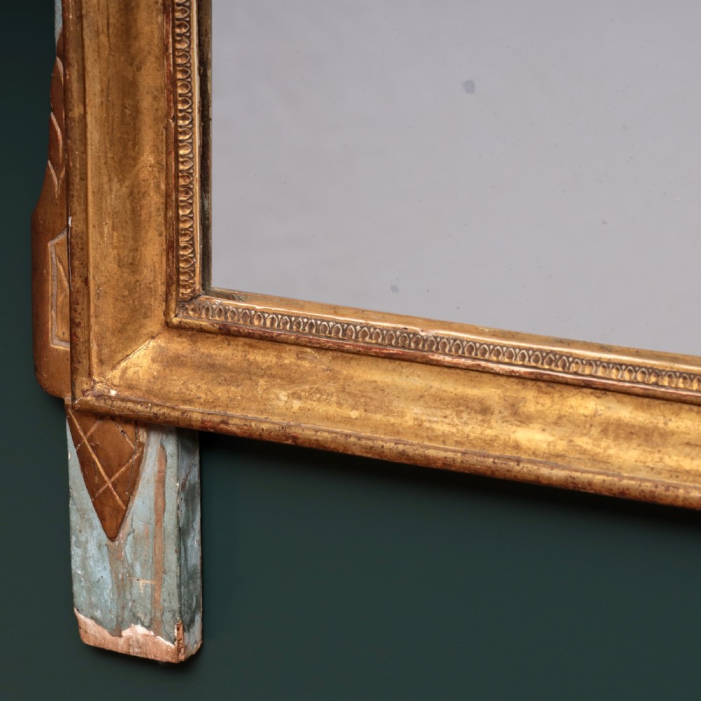 An 18th-century walnut commode featuring three wide drawers decorated with brass rosette swing handles and keyhole escutcheons on tapered feet. View II