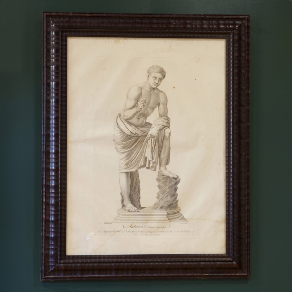 A set of six dark-framed monochrome antique engravings depicting classical statues arranged in two rows. View IV