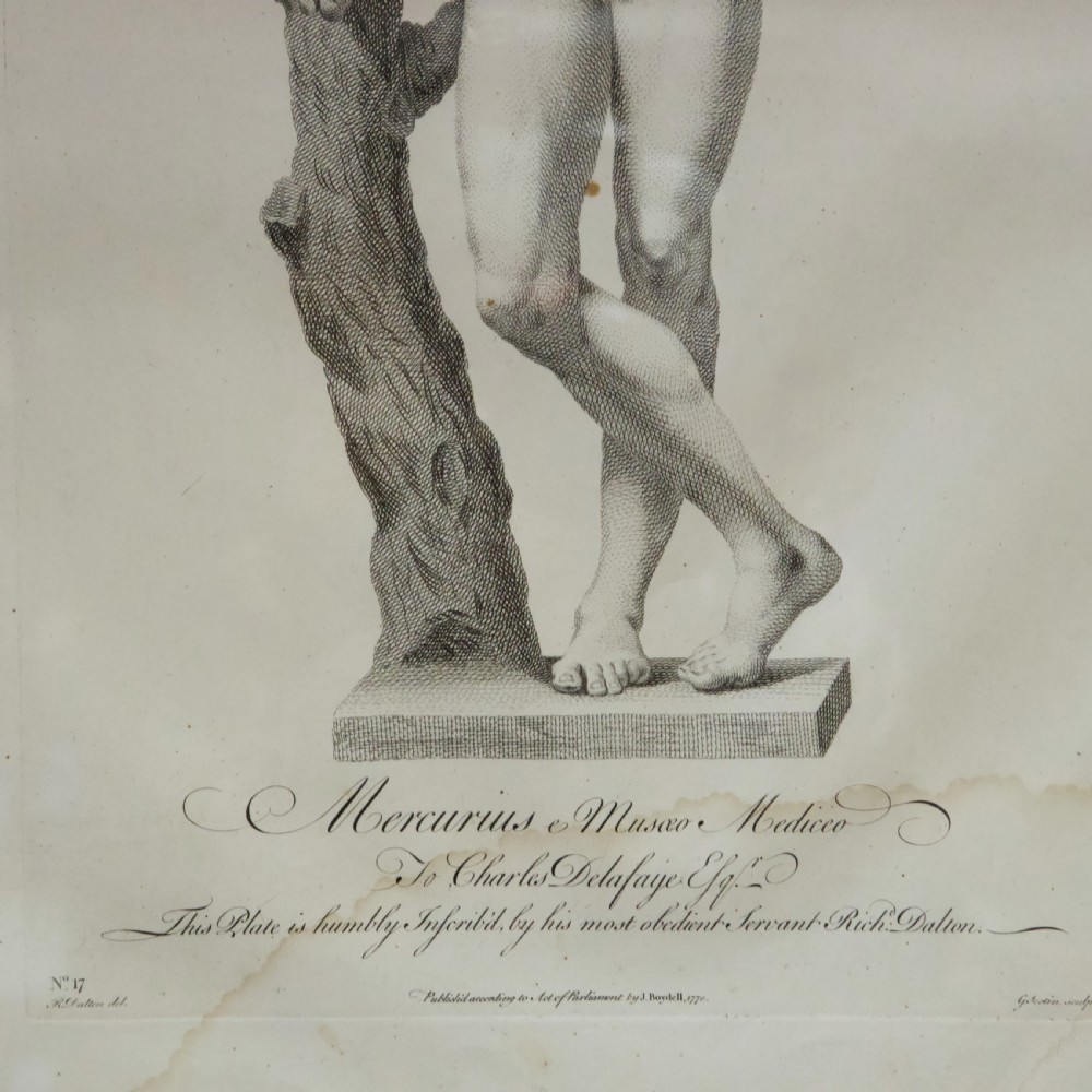 A set of six dark-framed monochrome antique engravings depicting classical statues arranged in two rows. View VII