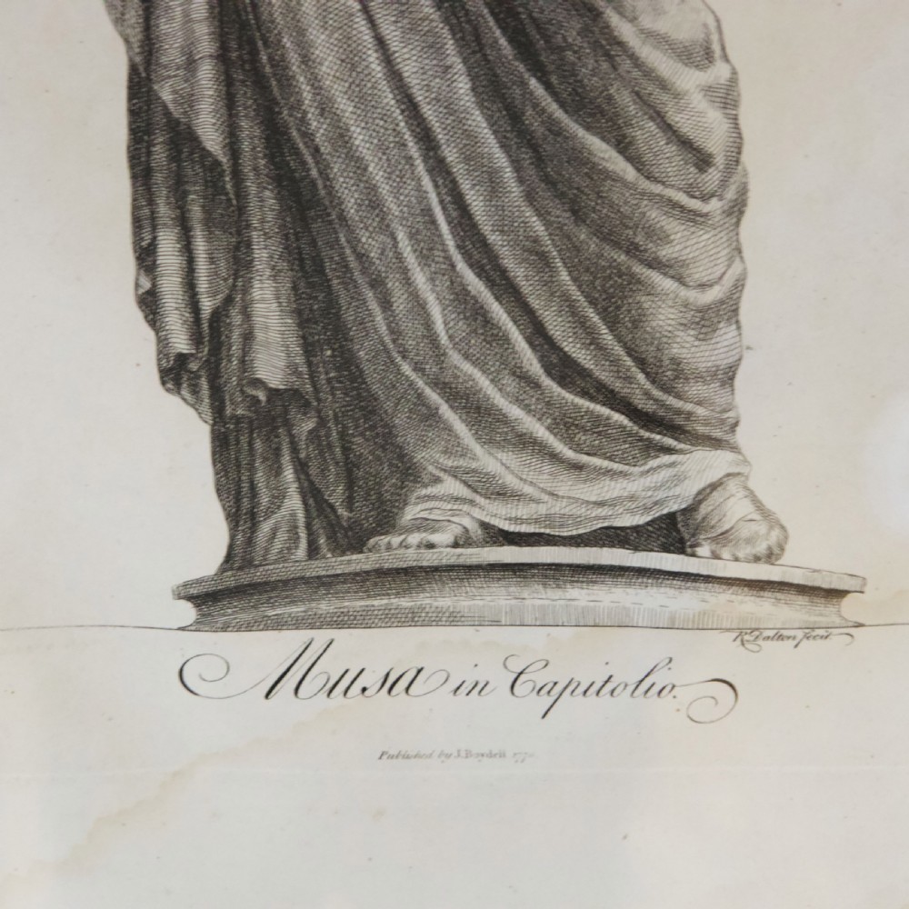 A set of six dark-framed monochrome antique engravings depicting classical statues arranged in two rows. View X