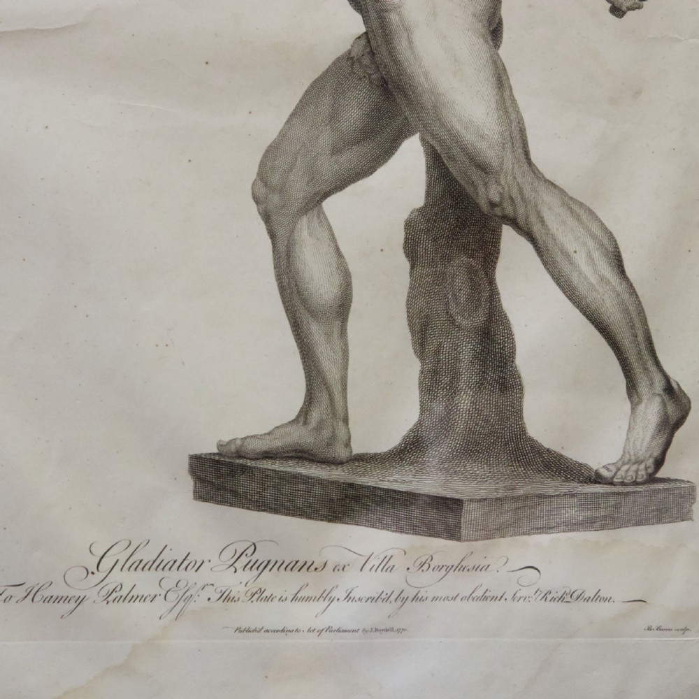 A set of six dark-framed monochrome antique engravings depicting classical statues arranged in two rows. View XI