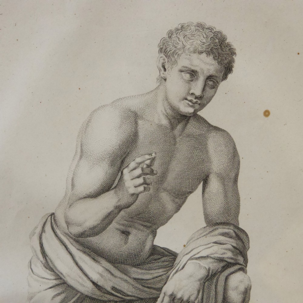 A set of six dark-framed monochrome antique engravings depicting classical statues arranged in two rows. View XII