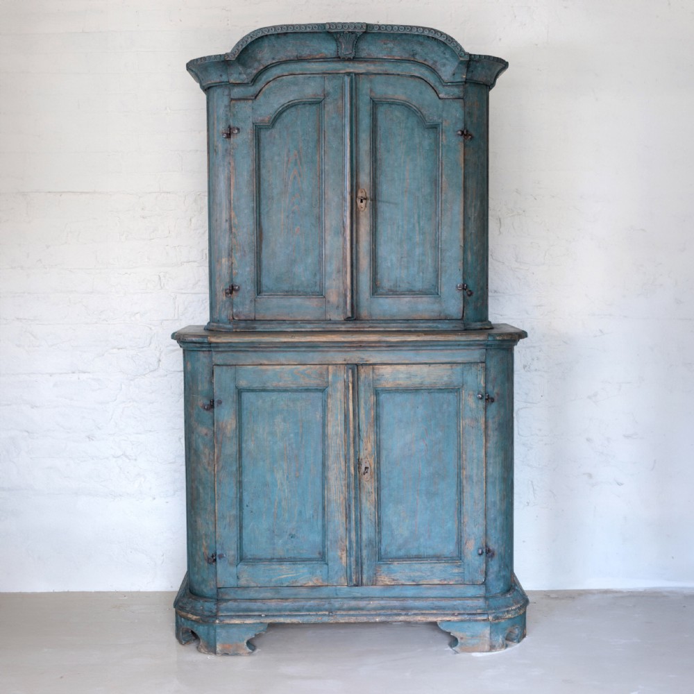 An eighteenth-century French buffet a deux corps with a distressed blue painted finish, arched upper cabinet doors, and iron hardware. View II