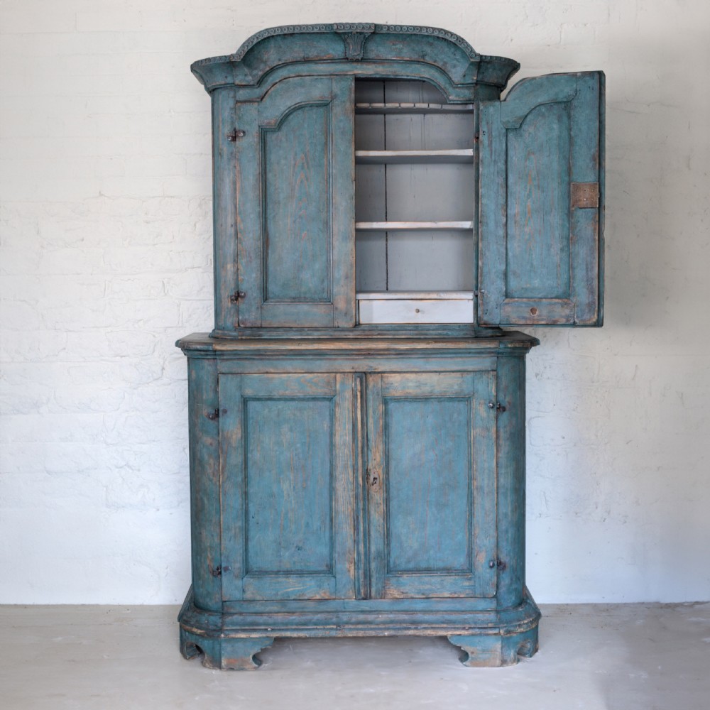 An eighteenth-century French buffet a deux corps with a distressed blue painted finish, arched upper cabinet doors, and iron hardware. View V